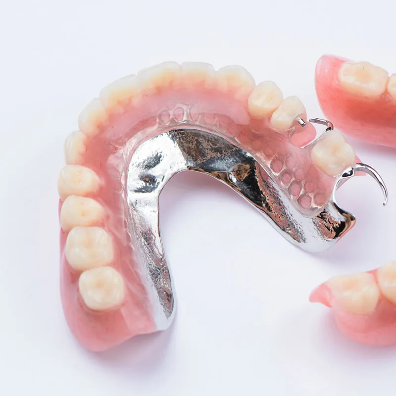 Partial denture: replacement teeth, base, metal framework and clasps